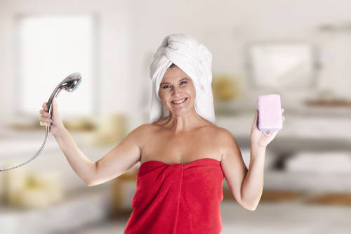 a woman with a towel on Head, after leaving the bathroom