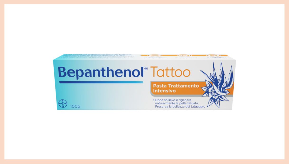 confezione crema lenitiva tatuaggi bianca arancione e azzurra con disegno