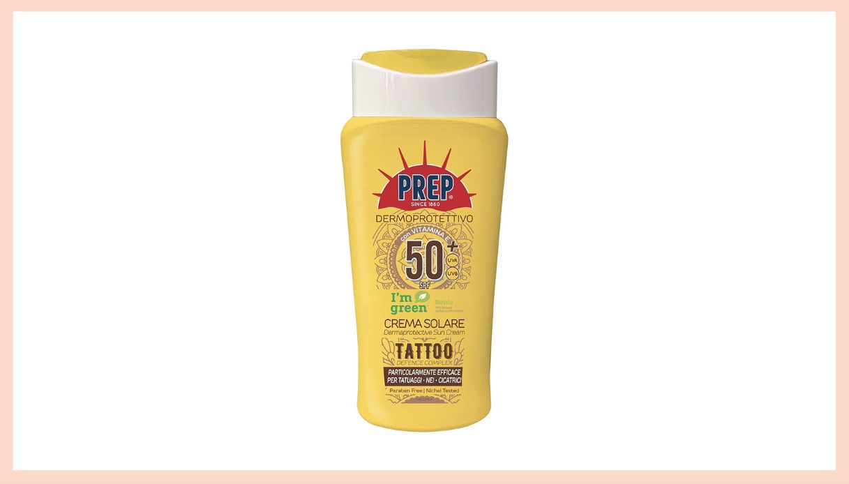 crema solare tatuaggi confezione gialla e bianca con scritte nere e rosse