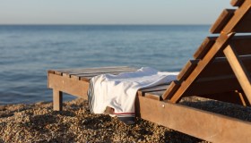 Come lavare i teli da mare in lavatrice, a quanti gradi e con quale detersivo