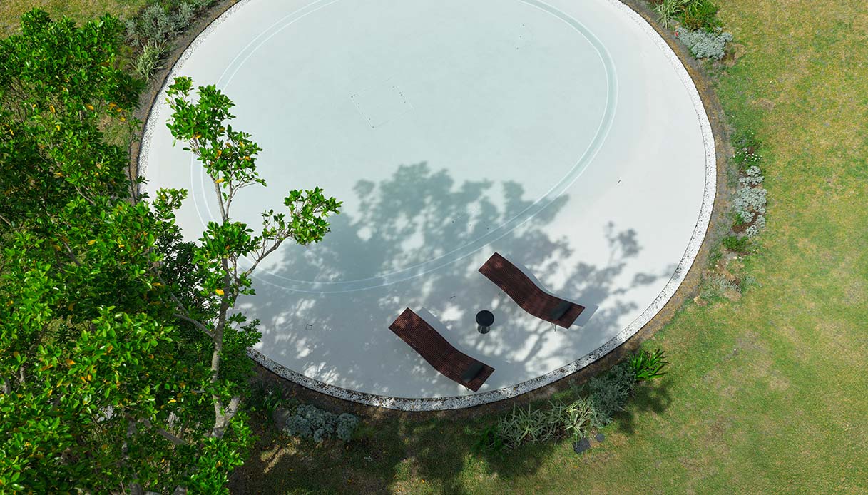 Cortile della villa Earth con area relax immersa nel giardino