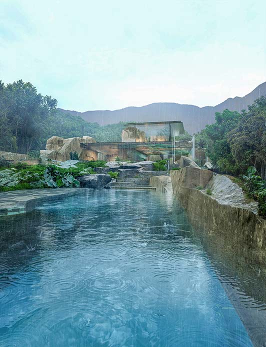 Piscina esterna immersa nella natura di Yakushima, con la villa sullo sfondo durante la pioggia