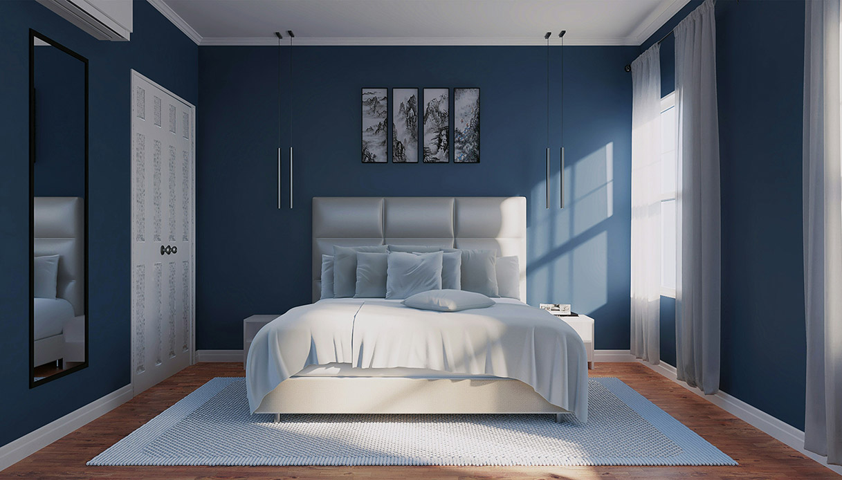 Camera da letto con parete azzurro cielo e arredo essenziale