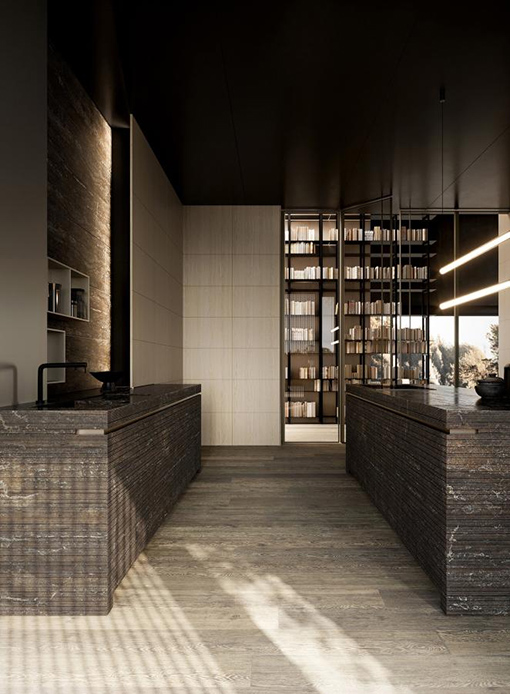 Cucina Bassanello Modulnova Presotto con due isole rivestite in pietra scura a rilievo orizzontale, libreria metallica con luce calda e soffitto nero opaco