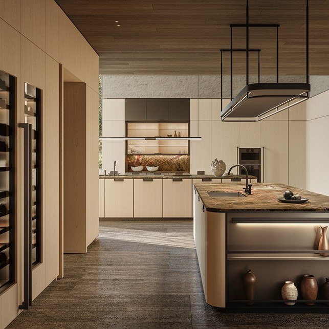 Cucina Molteni&C Physis con colonne alte in rovere, isola curva con top in pietra verde scuro, cappa squadrata nera e vetrina vini integrata a sinistra