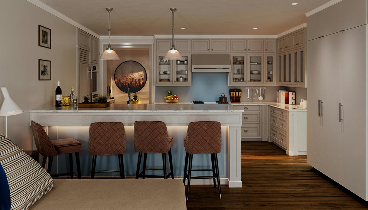 Cucina open space con lungo bancone in marmo bianco, tre sgabelli imbottiti marroni e illuminazione calda a sospensione, integrata con zona soggiorno