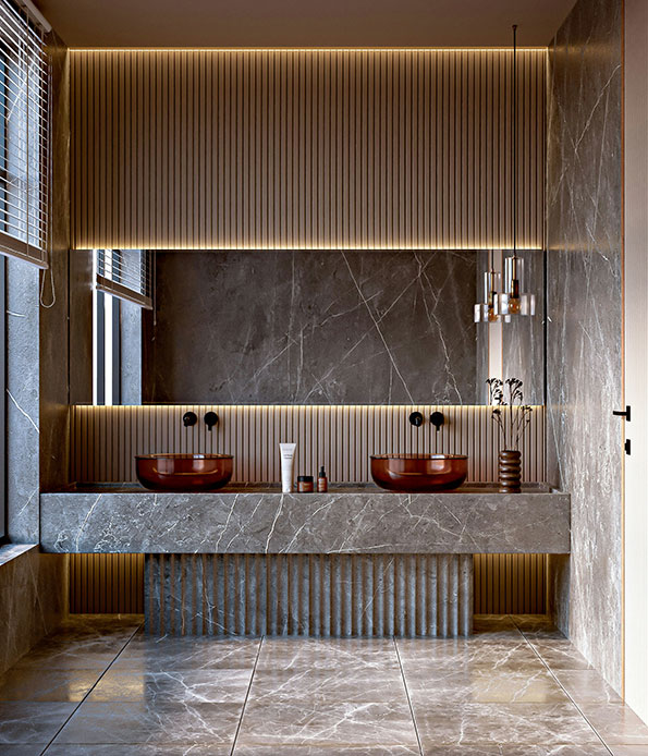 Doppio lavabo in marmo scuro con catini in ceramica rossa, pannello a doghe retroilluminato e lampade a sospensione