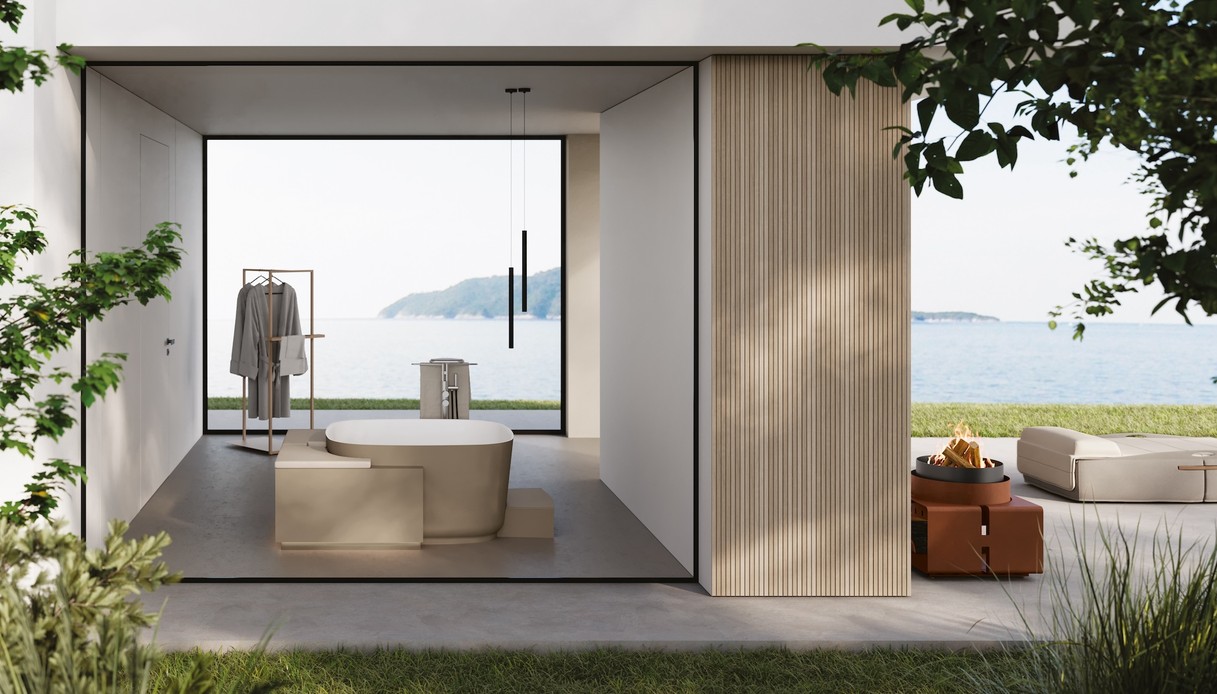 Sedute che uniscono interno ed esterno, superfici riciclate e spa domestiche ridefiniscono il lusso in chiave umana e sostenibile